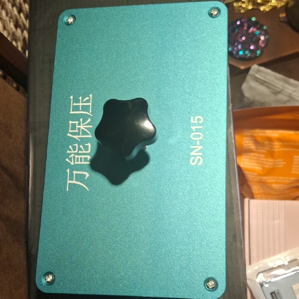 Teal Cell Phone Repair Device with Black Knob